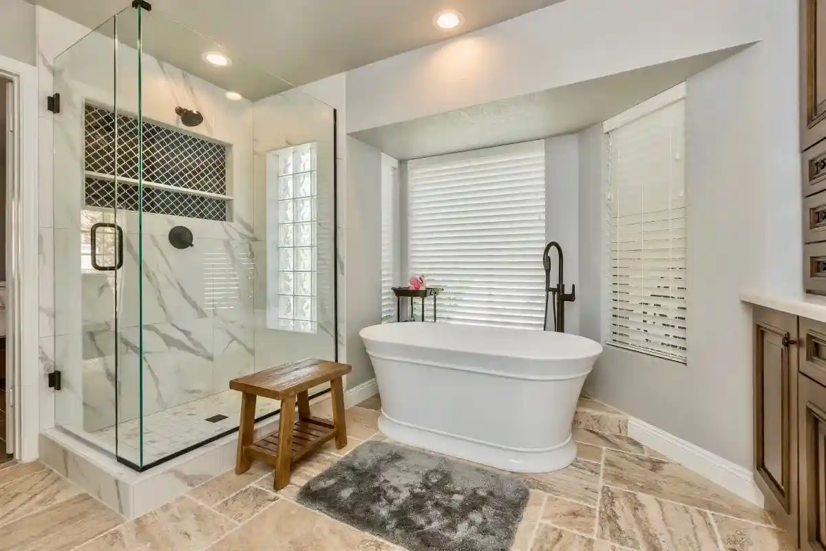 Modern bathroom with upgraded LED recessed lighting and vanity lighting installed by a licensed electrician, improving brightness and energy efficiency during a residential lighting upgrade.